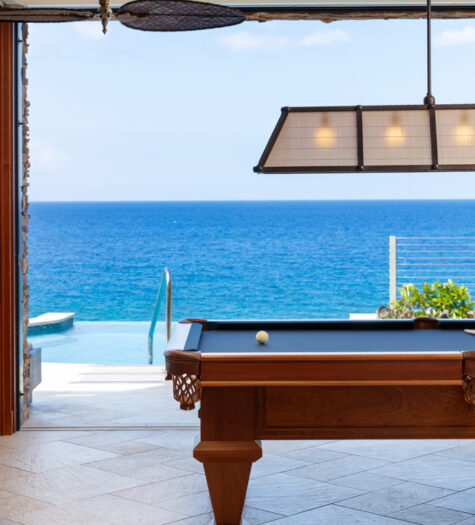 Billiard room with ocean views in a luxury Hawaii vacation home designed by LiLu Interiors