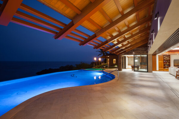 hawaii-pool-night-lighting-luxury-waterfront-home