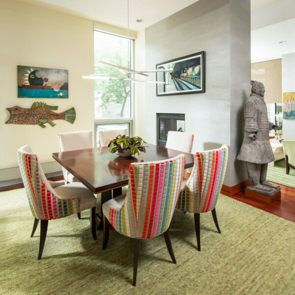 Neutral green dining room designed by LiLu Interiors in a Minneapolis condo