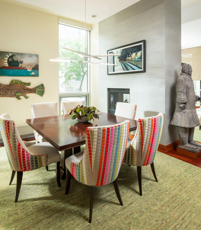 Neutral green dining room designed by LiLu Interiors in a Minneapolis condo